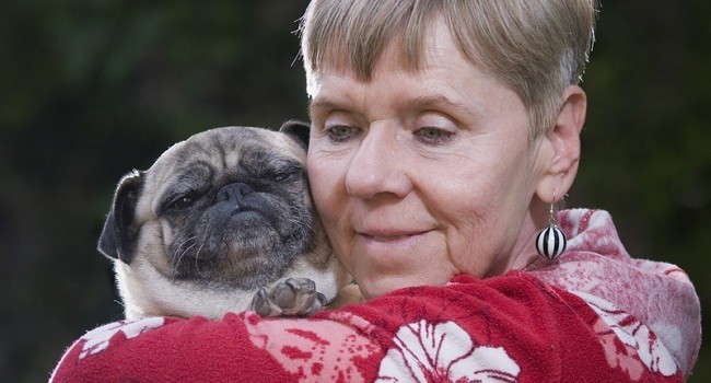 senior citizen with pug