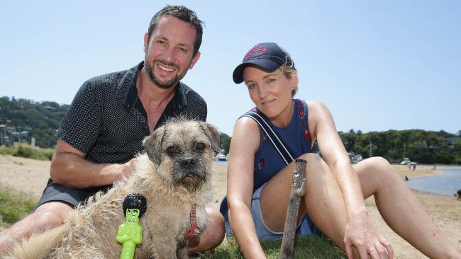 couple with their pug