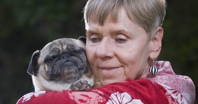 elderly woman with pug